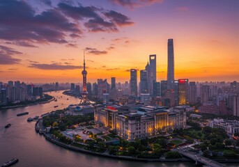 Fototapeta premium Aerial view of shanghai skyline with river and boats at sunset or sunrise time