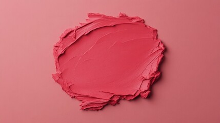 Fototapeta premium Smooth pink cosmetic cream spread on a matching pink background, creating a textured, artistic look.