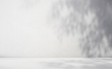 Light gray room background with shadow and light from windows on white wall for product presentation.