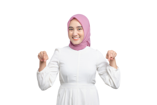 Cheerful young Asian Muslim woman pointing fingers down, showing free place for advertisement isolated on transparent background