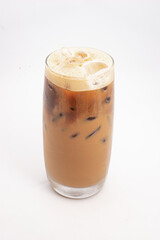 iced coffee with cream and ice cubes served in tall clear glass with foamy top photographed on white background. High quality photo
