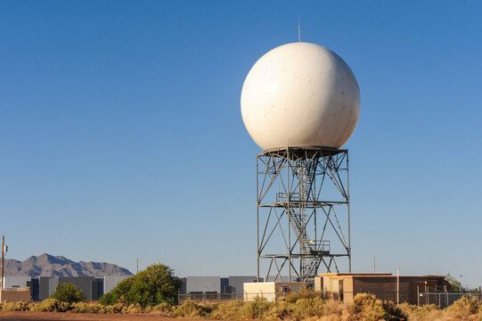 A Doppler weather radar dome sits atop a steel tower, forming part of a national network that monitors atmospheric conditions for forecasting, aviation safety, and severe weather detection