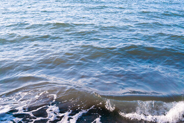 Rough seas and crashing waves in motion blur creating a dynamic texture of stormy surface of the...