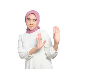 Serious young Asian Muslim woman making stop gesture and showing rejection isolated on transparent...