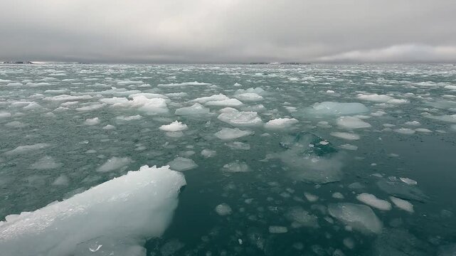 Motoring through brash slush ice in Moon Bay Antarctica Peninsula South Shetland Islands 