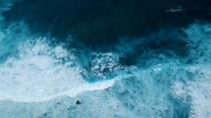 Seascape dark ocean background wave splash on rock. Tropical sea beach in summer seaside outdoor. Water Surface blue wave pattern. Turquoise ocean sea water white wave pattern splashing deep blue sea © aFotostock