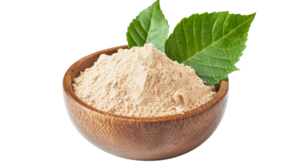 Wooden bowl holds beige powder, fresh green leaves give it joy