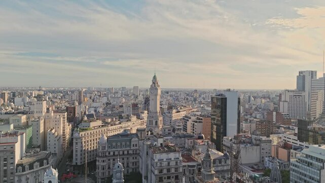 Panoramic aerial shot moving left across central Buenos Aires with historic and modern buildings, featuring the iconic Cabildo and the clock tower.
