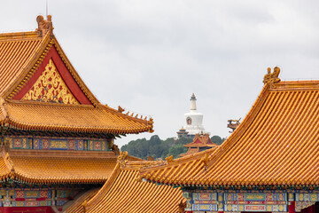 View of the White Pagoda in Beihai Park from inside the Forbidden City in Beijing, China