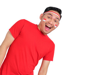 Shocked young Asian man celebrating Indonesian independence day looking at camera with funny...