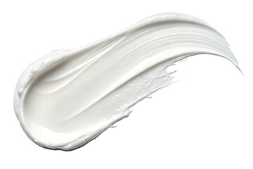 A creamy white swirl of lotion or moisturizer against a stark black background in a studio shot