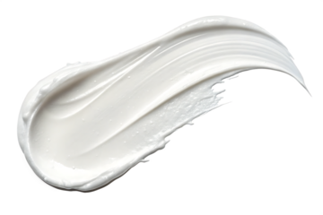 A creamy white swirl of lotion or moisturizer against a stark black background in a studio shot
