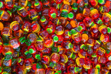 Fototapeta premium Background of assorted colorful marmalade candies. View from above. Jelly candies