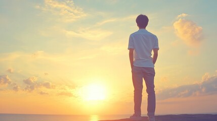 Man watching sunset over ocean