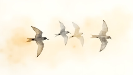Fototapeta premium Abstract watercolor of birds in flight, rendered in warm gray and gold strokes against an ivory-beige backdrop. The loose forms evoke freedom, with soft fading edges enhancing the airy feel.