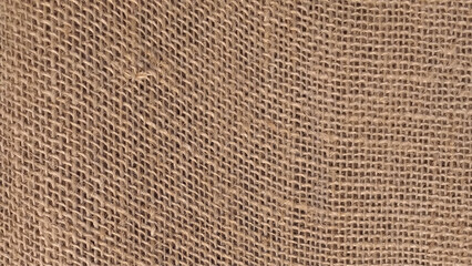 Sackcloth textured background. Jute pattern, rough burlap texture, canvas coarse cloth, brown woven rustic bagging. Natural hessian beige textile texture.  