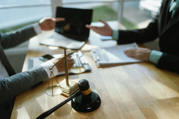 Professional lawyer advising client on legal contractsensuring justice, compliance, and financial...