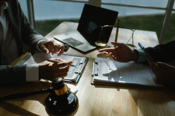 Professional lawyer advising client on legal contracts—ensuring justice, compliance, and...