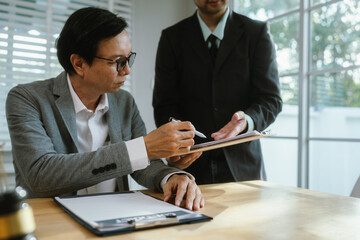 Professional lawyer advising client on legal contracts—ensuring justice, compliance, and...