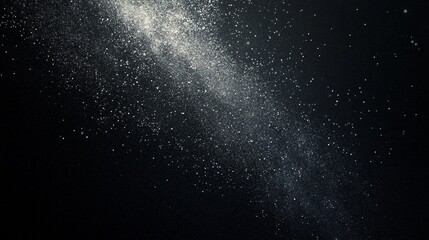 Obraz premium Cosmic Dust Particles Glimmer Against a Black Background Creating a Stunning Representation of the Universe