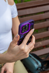 Close-up of female hands using smart phone. High quality photo