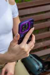 Close-up of female hands using smart phone. High quality photo