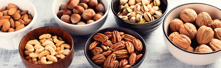 Different kinds of nuts in a bowls.