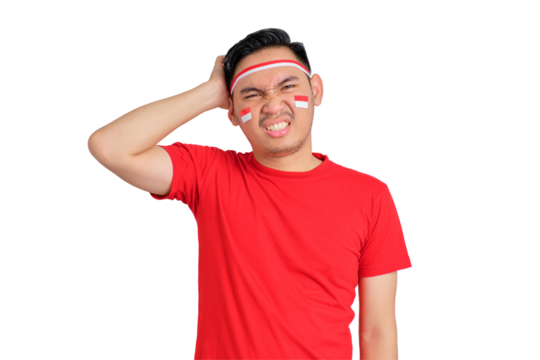 Confused young Asian man celebrating Indonesian independence day scratching head with puzzled face isolated on transparent background