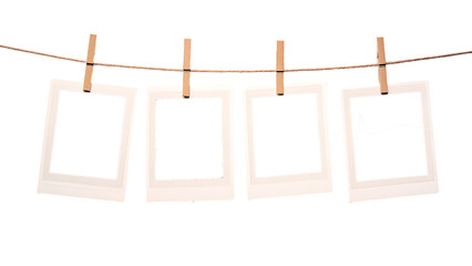 blank polaroid photo frames hanging on clothesline on transparent background PNG