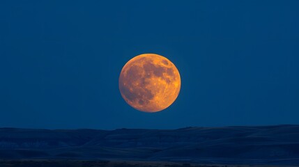 Supermoon Rising: A supermoon rising above the horizon, glowing brightly in the sky. 
