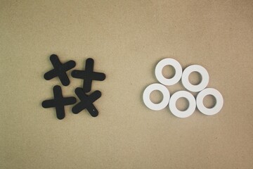 the letters x and o are separated. wooden Tic Tac Toe game or OX game