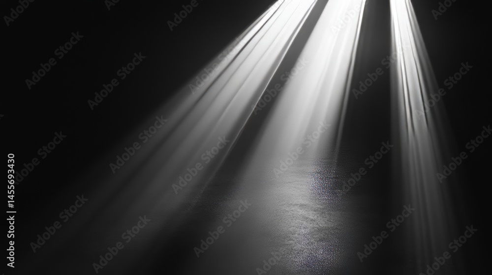 Poster light beams create a dramatic atmosphere in an empty dark space highlighting textures on the floor d