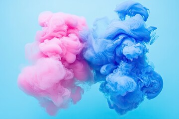 Abstract swirls of pink and blue ink in water.  Cloud-like shapes, contrasting colors on a light blue backdrop