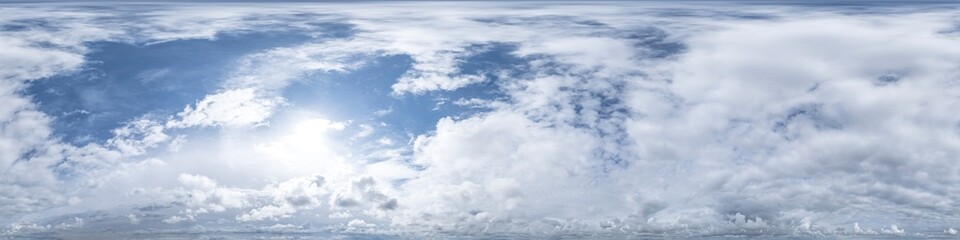 Spherical panorama of cloudy sky with sun shining through clouds
