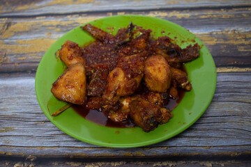 A delicious chili chicken dish, served fresh with a thick red sauce.