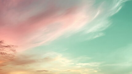 Obraz premium Wispy clouds float gently across a soft gradient horizon, blending pastel hues to create a tranquil and dreamy ambiance perfect for relaxation or inspiration