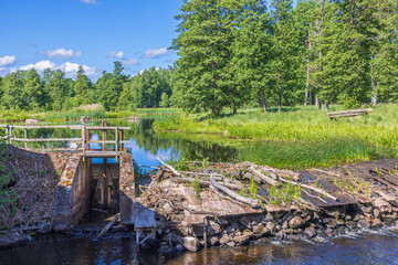 Fototapeta premium Water dam in a beautiful rural landscape