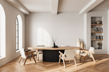 Minimalist contemporary interior design with wooden furniture, round table, and built-in bookshelf in sunlit neutral room with soft shadows. 3D Rendering