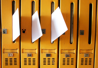 Mail boxes in the collective housing building with some letters