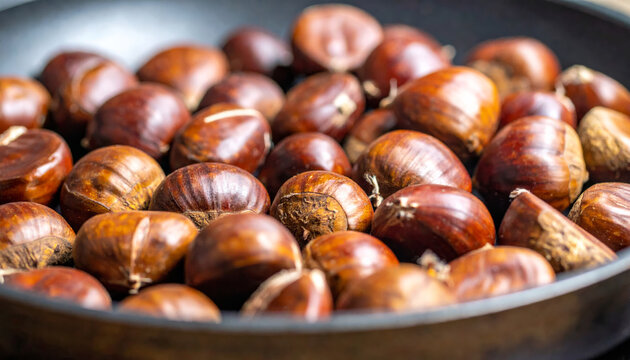 Roasted chestnuts in pan create warm and inviting atmosphere, perfect for cozy gatherings. Their rich, glossy shells and earthy aroma evoke feelings of nostalgia and comfort