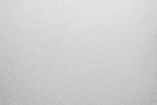 Subtle light gray plaster wall background with gentle texture ideal for clean product mockup design advertising branding copy space