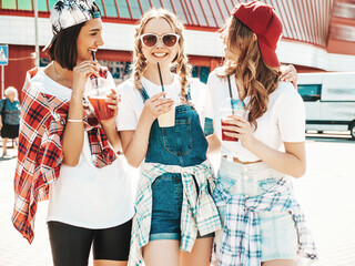 Three young beautiful smiling hipster female in trendy summer clothes.Sexy carefree women posing...