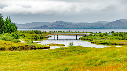 Thingvellir National Park, Iceland, Famous geological and historical site with a river stream and lake, summer, South West Iceland, scenic dramatic view