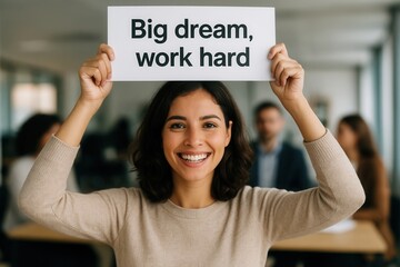 A woman holding a sign that reads "YOU CAN DO BETTER!!" in bold letters, encouraging motivation and improvement in a workplace setting