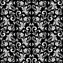 Wallpaper in the style of Baroque. White and black floral ornament. Seamless vector background. Graphic pattern for fabric, wallpaper, packaging. Ornate Damask flower illustration.