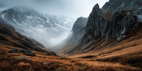 Misty Cliffside Mountain Rising Above Golden Grass Hillside in Autumn Light, Dramatic Landscape with Steep Rocky Slopes, Rugged Nature Scene Evoking Solitude, Wilderness, and Majestic Elevation
