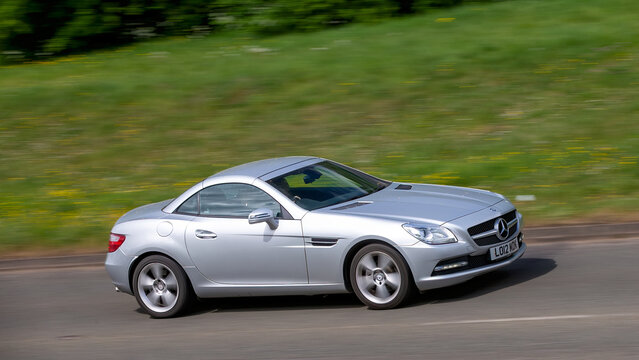 Milton Keynes,Bucks,.UK - May 4th 2025:  2012 Mercedes Benz slk car driving on a British road