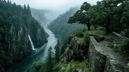 A dramatic waterfall plunging into a deep gorge, the mist rising from the churning water below.