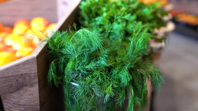 Handheld shot of dill in glasses in a kitchen, indoor, medium shot