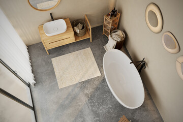 Modern minimalist bathroom interior, modern bathroom cabinet, white sink, wooden vanity, interior plants, bathroom accessories, bathtub , beige walls, granite floor, vases. 3d rendering